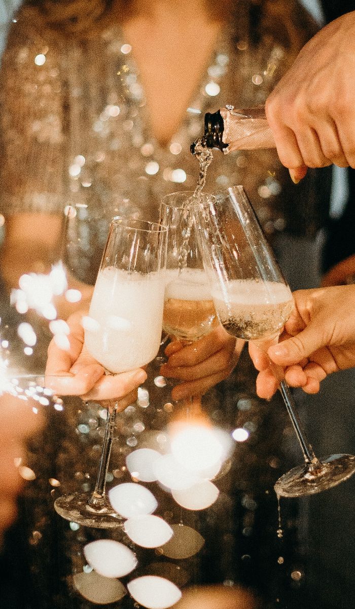 person-pouring-champagne-on-champagne-flutes-3171770(1)
